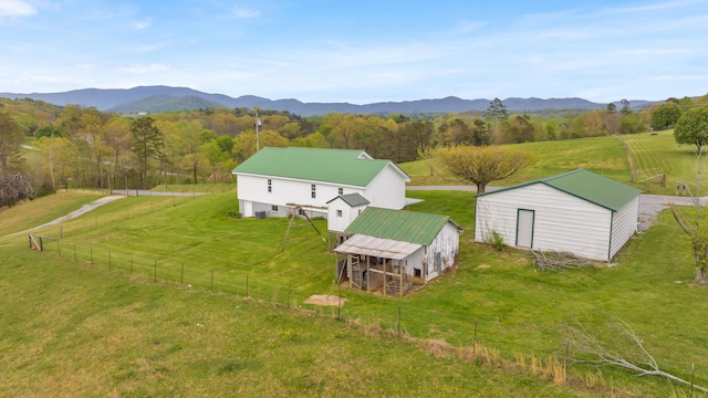 birds eye view of property with a mountain view and a rural view