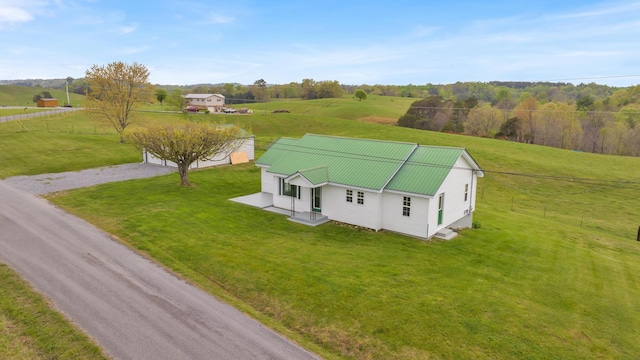 birds eye view of property with a rural view