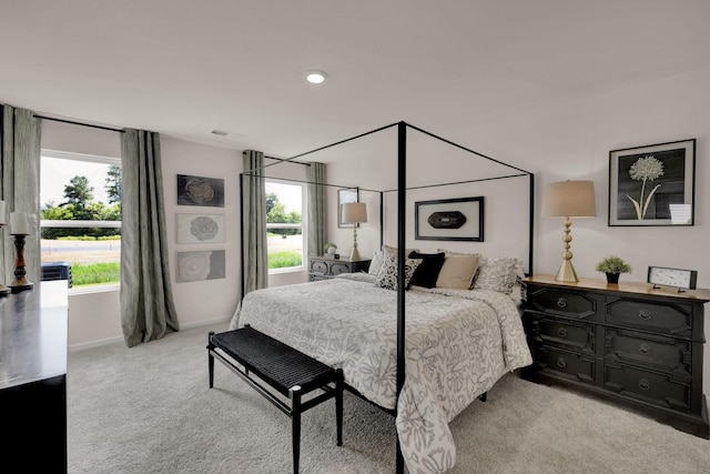 bedroom featuring carpet and baseboards