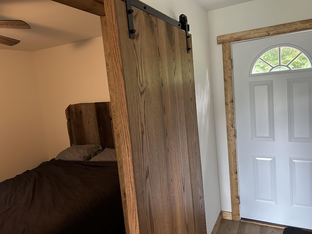 1101 Beason Ridge Rd, New Tazewell, TN 37825 - foyer entrance with a barn door, wood finished floors, and ceiling fan