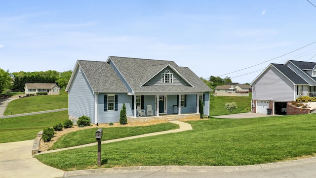 traditional home featuring concrete driveway, a front yard, and covered porch
