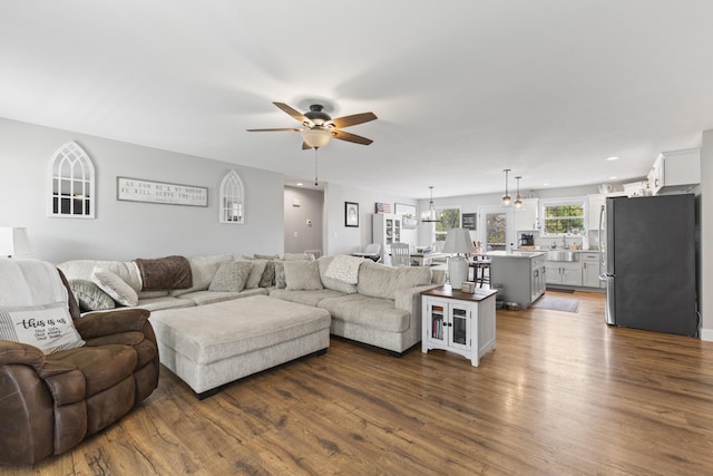 living room with recessed lighting, a ceiling fan, and dark wood-style flooring