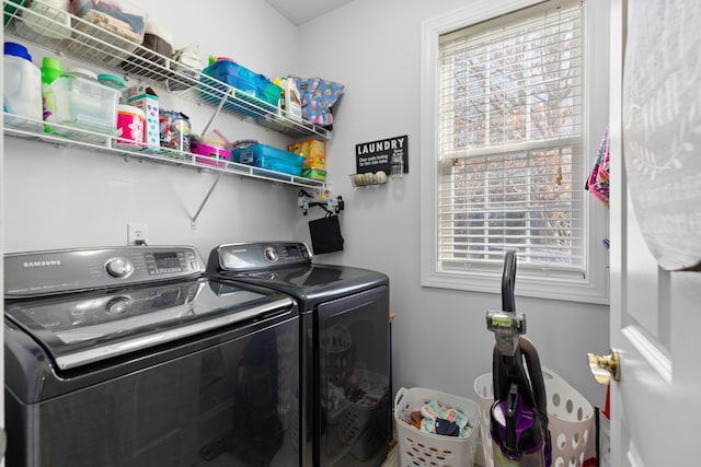 clothes washing area with independent washer and dryer