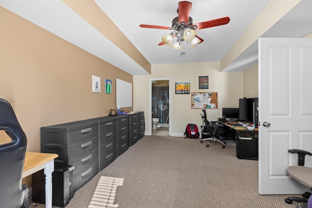 home office featuring light colored carpet and ceiling fan