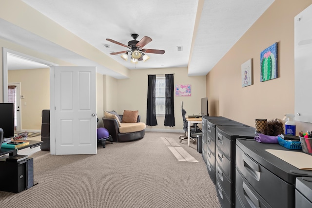 interior space featuring light carpet and ceiling fan