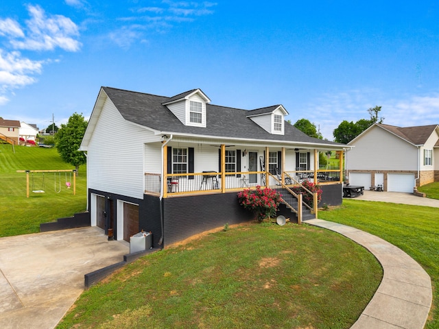 cape cod-style house featuring covered porch, a front yard, stairway, an attached garage, and a shingled roof