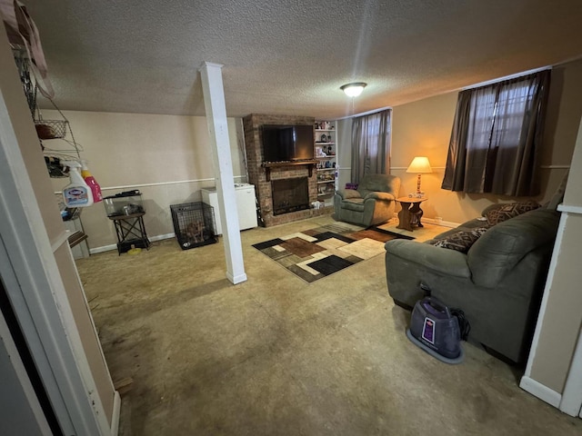 living room featuring baseboards, a textured ceiling, and a fireplace