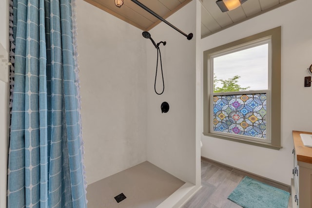 3466 Caywood Rd, Dandridge, TN 37725 - full bath featuring a shower with shower curtain, wood finished floors, and vanity