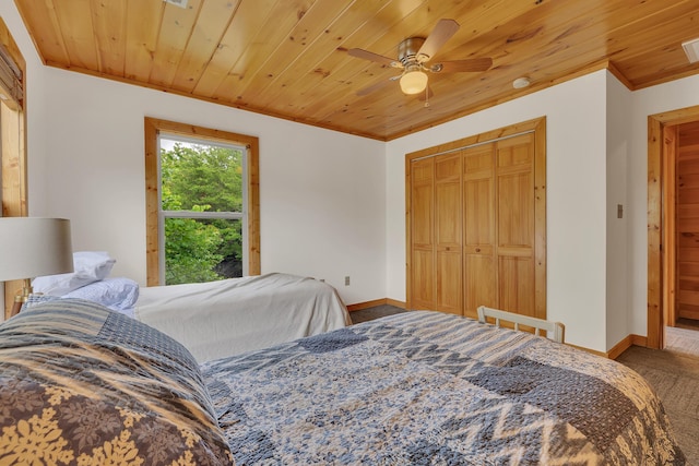 3466 Caywood Rd, Dandridge, TN 37725 - bedroom with carpet flooring, wooden ceiling, baseboards, a closet, and a ceiling fan