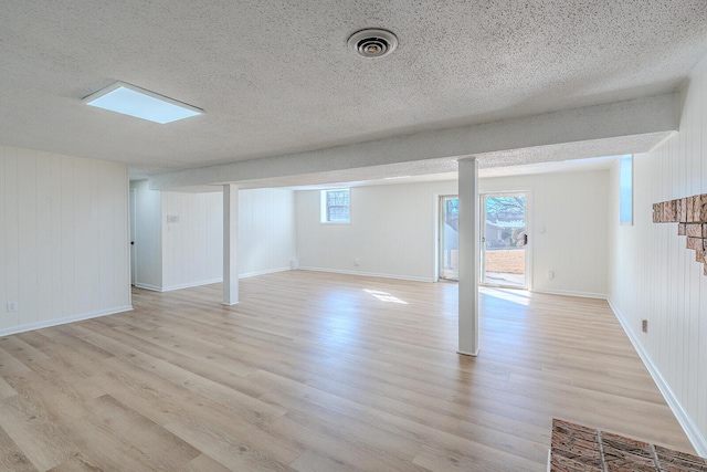 basement featuring light wood-type flooring