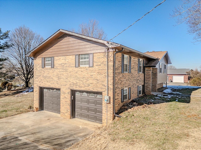 view of property exterior featuring a yard and a garage