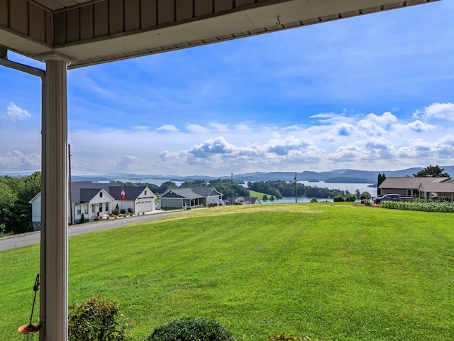 355 Pheasant Vw, Rutledge, TN 37861 - view of green lawn featuring a water and mountain view, a garage, and asphalt driveway