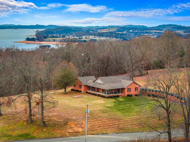 aerial view featuring a water and mountain view