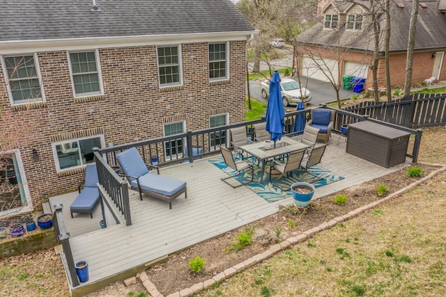 wooden terrace featuring fence