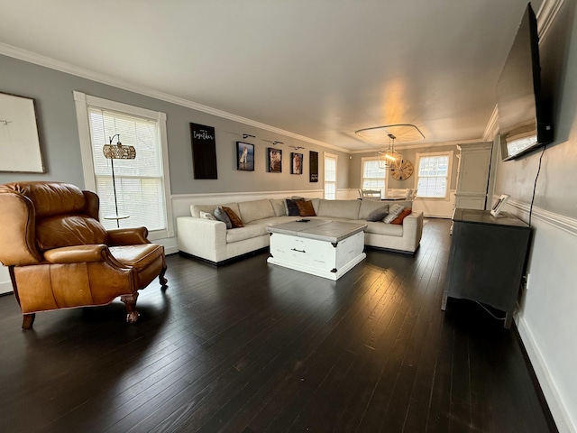 living room with dark wood finished floors, baseboards, and ornamental molding