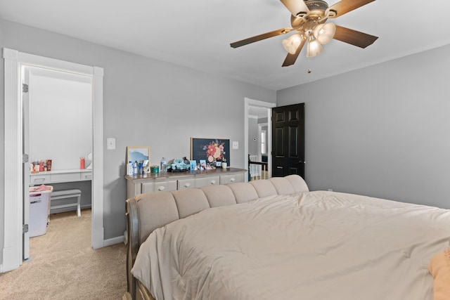 bedroom featuring ceiling fan, baseboards, and light carpet