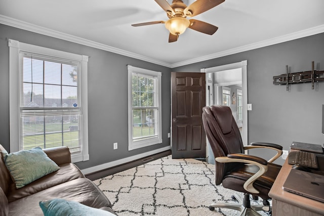 home office with baseboards, a ceiling fan, and ornamental molding