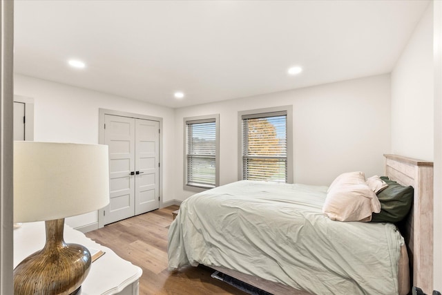 bedroom featuring a closet and light hardwood / wood-style floors