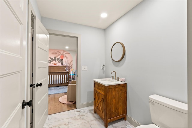 bathroom featuring vanity and toilet