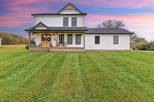 view of front of property with a lawn