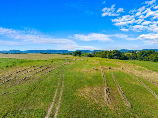 drone / aerial view with a mountain view and a rural view