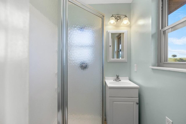 full bath featuring a shower stall and vanity