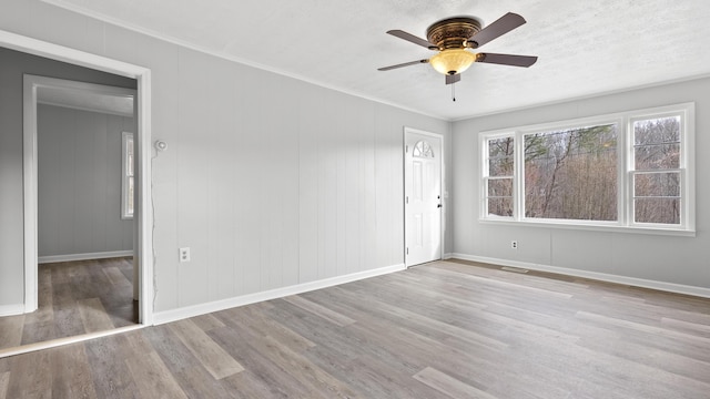 1501 Cherry Bottom Rd, Caryville, TN 37714 - spare room with ornamental molding, ceiling fan, and light hardwood / wood-style flooring