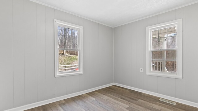 1501 Cherry Bottom Rd, Caryville, TN 37714 - empty room featuring hardwood / wood-style floors and ornamental molding