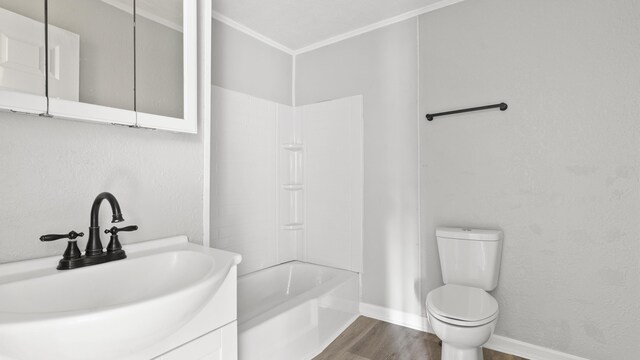 1501 Cherry Bottom Rd, Caryville, TN 37714 - full bathroom with sink, toilet, wood-type flooring, bathing tub / shower combination, and crown molding