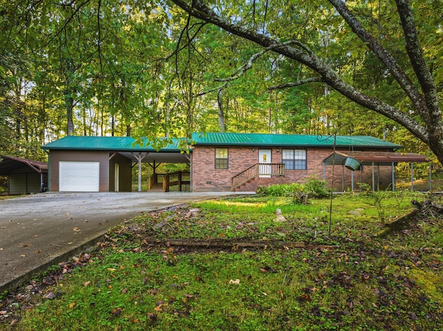 ranch-style house with a garage and a carport