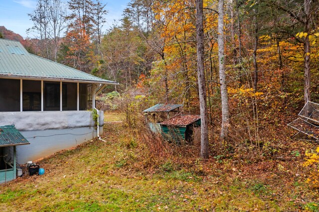 view of yard featuring a sunroom