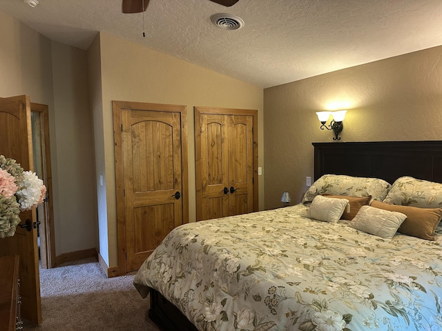 3041 Wineberry Ln, Morristown, TN 37814 - bedroom featuring vaulted ceiling, carpet, multiple closets, a textured ceiling, and a ceiling fan