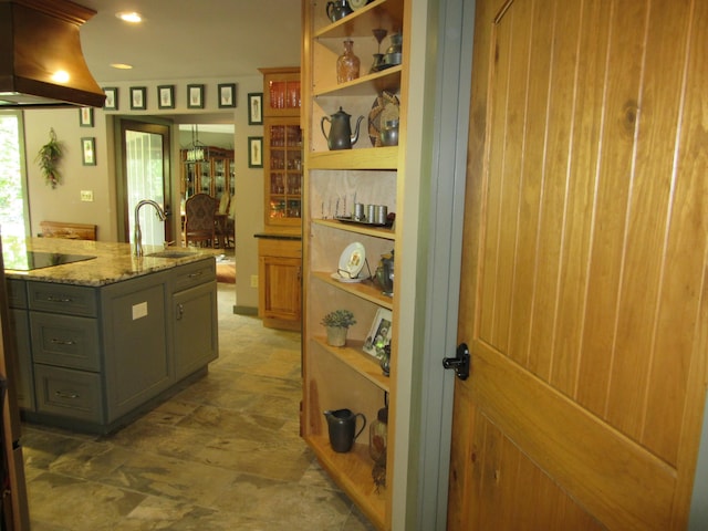 3041 Wineberry Ln, Morristown, TN 37814 - kitchen featuring a sink, island range hood, open shelves, stone finish flooring, and black electric stovetop