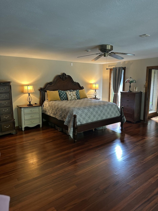 3041 Wineberry Ln, Morristown, TN 37814 - bedroom featuring dark wood-style floors, a ceiling fan, and a textured ceiling
