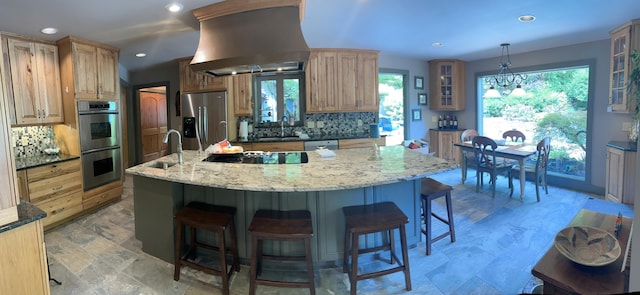 3041 Wineberry Ln, Morristown, TN 37814 - kitchen featuring appliances with stainless steel finishes, exhaust hood, a kitchen breakfast bar, tasteful backsplash, and recessed lighting