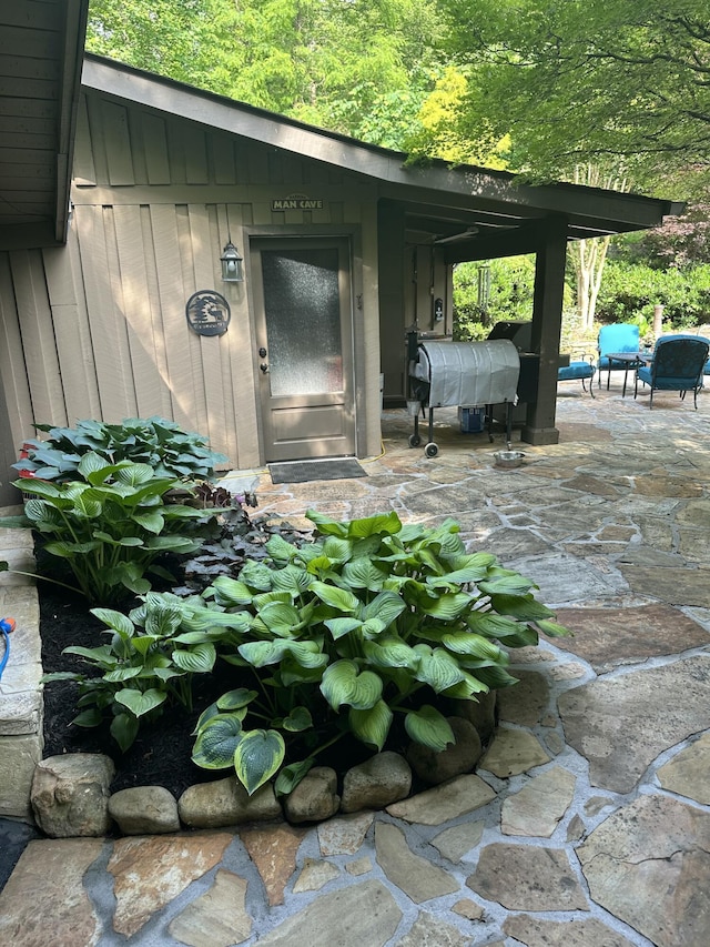 3041 Wineberry Ln, Morristown, TN 37814 - property entrance with a patio and board and batten siding