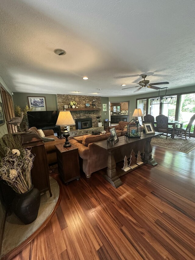 3041 Wineberry Ln, Morristown, TN 37814 - living area featuring a textured ceiling, hardwood / wood-style floors, a fireplace, and ceiling fan