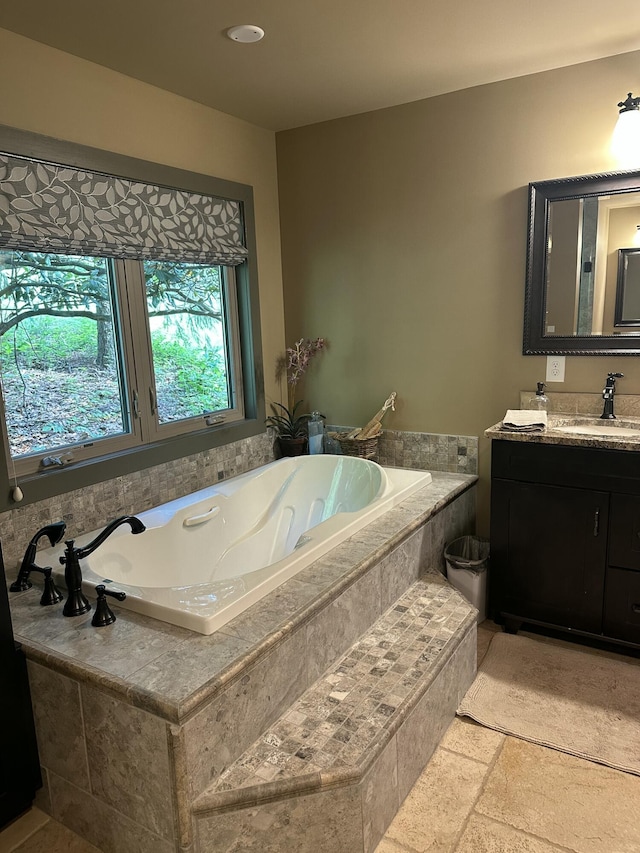3041 Wineberry Ln, Morristown, TN 37814 - bathroom featuring vanity, a bath, and stone tile floors