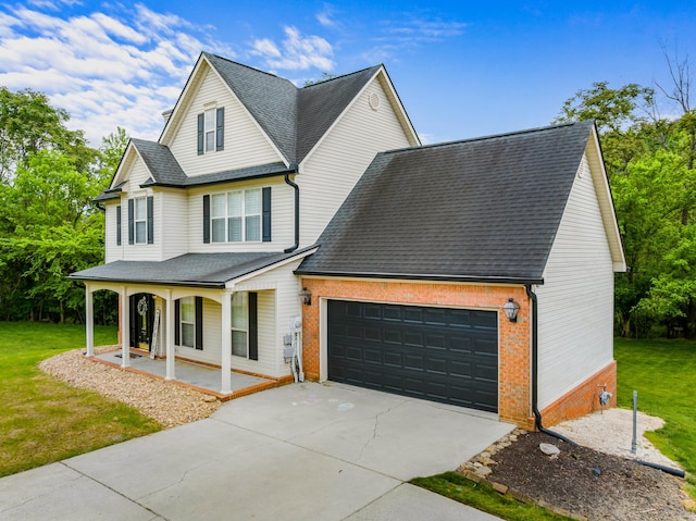 view of front of home featuring roof with shingles, an attached garage, a porch, a front yard, and driveway