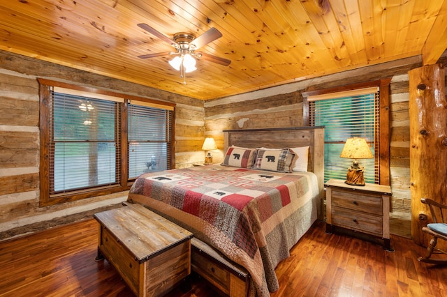 bedroom with ceiling fan, hardwood / wood-style floors, and wooden ceiling