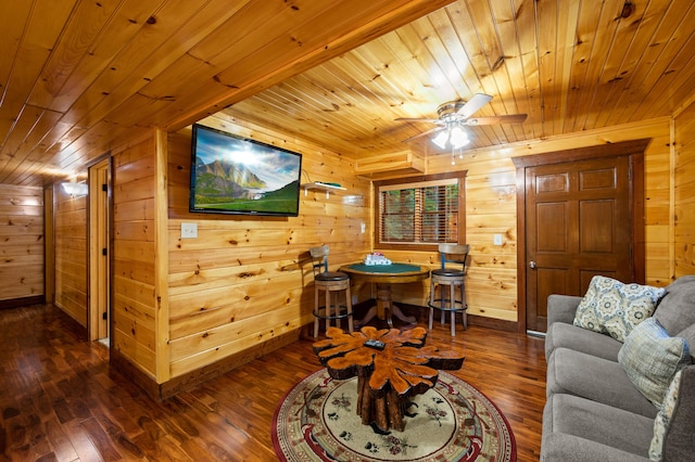 living room with wooden ceiling and wooden walls