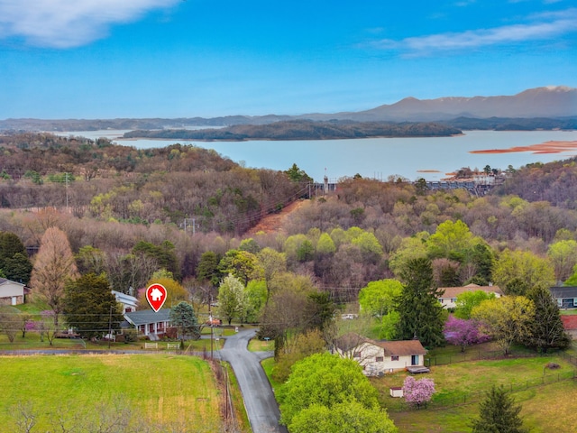 bird's eye view with a water and mountain view