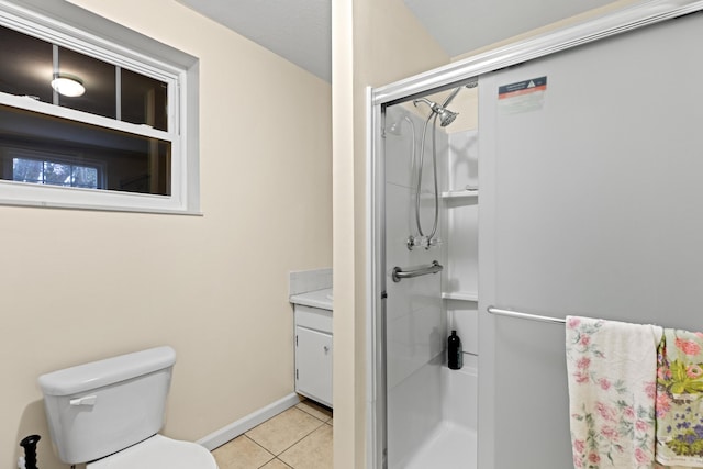 bathroom with vanity, toilet, tile patterned floors, and a shower stall