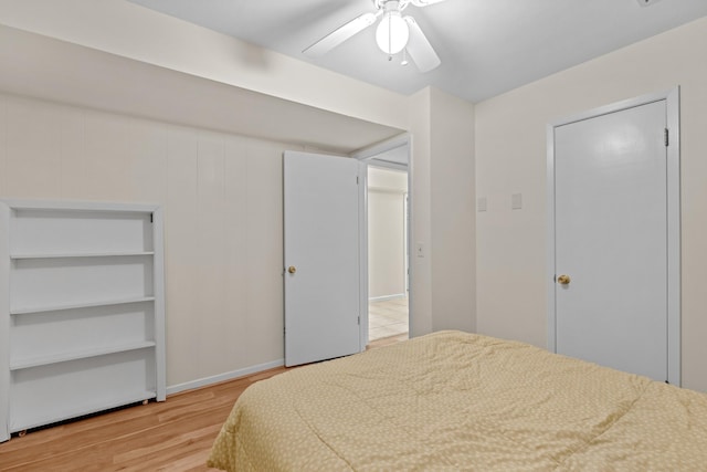 bedroom with wood finished floors and a ceiling fan
