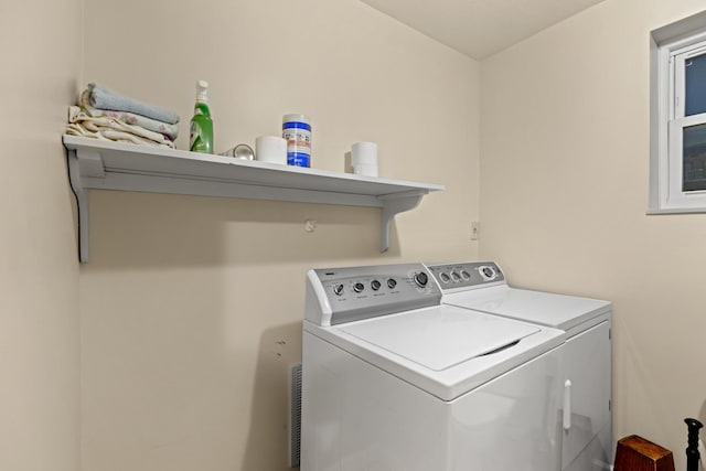 laundry area featuring independent washer and dryer and laundry area