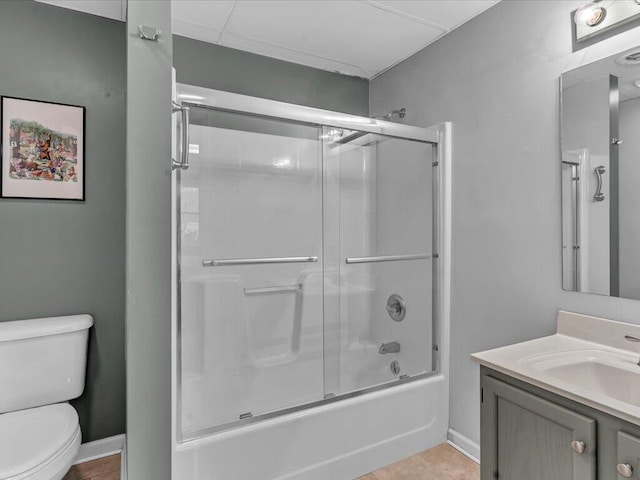 full bathroom featuring toilet, tile patterned floors, enclosed tub / shower combo, and vanity