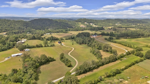 birds eye view of property featuring a rural view