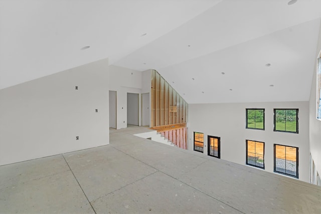 bonus room featuring high vaulted ceiling