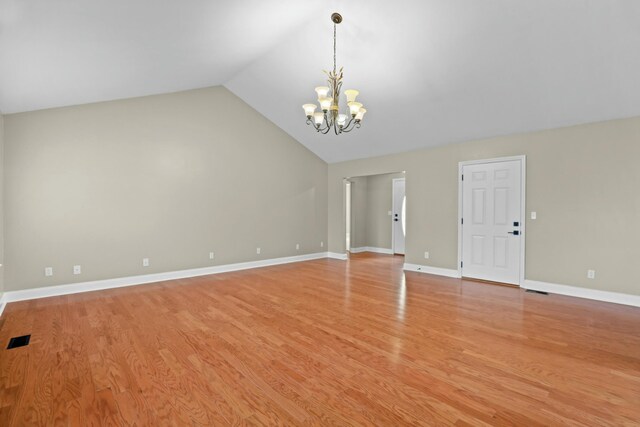 749 Harvest Meadows Dr, Kodak, TN 37764 - interior space featuring light wood-style floors, visible vents, a chandelier, lofted ceiling, and baseboards