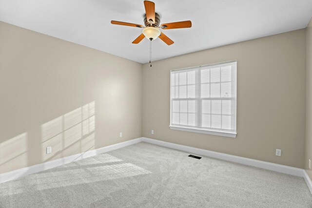 749 Harvest Meadows Dr, Kodak, TN 37764 - carpeted empty room with visible vents, baseboards, and a ceiling fan